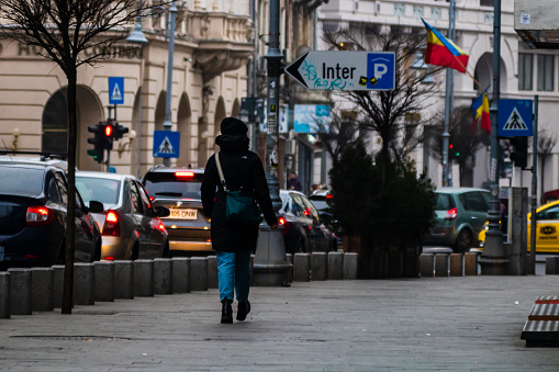 People moving, pedestrians walking in downtown district of Bucharest, Romania, 2021