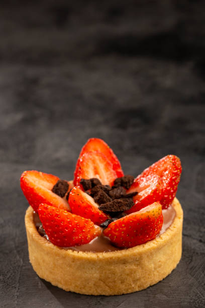 istock Tasty strawberry tartlet on the table. 1408941187