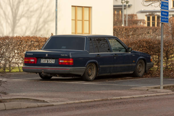 Dark blue Volvo 740 GL car in a parking lot.. Mölndal, Sweden - January 27 2022: Dark blue Volvo 740 GL car in a parking lot. volvo 740 stock pictures, royalty-free photos & images