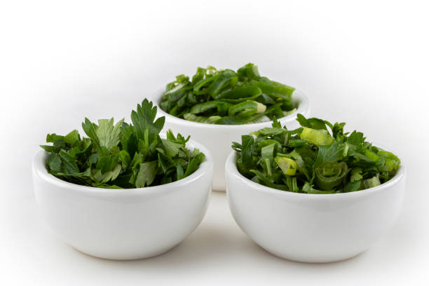istock Sliced cilantro, chives and parsley in ramekin. 1408949105