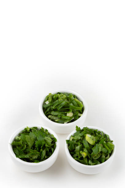 istock Sliced cilantro, chives and parsley in ramekin. 1408949139