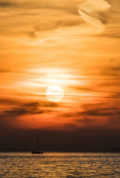 istock Beautiful sunset with boat 1408951233