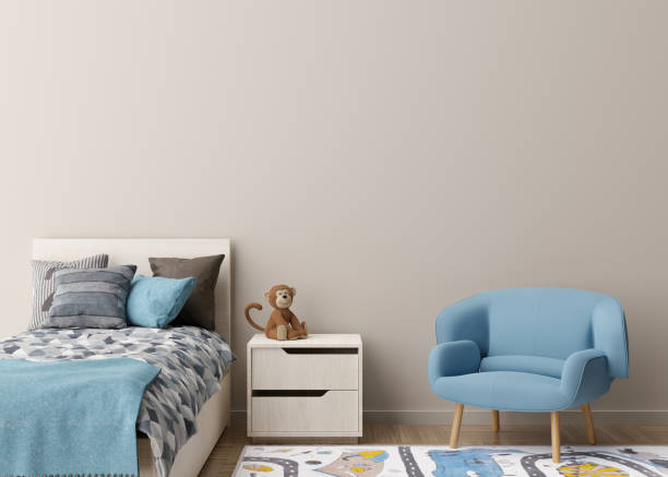 istock Empty cream wall in modern child room. Mock up interior in scandinavian style. Copy space for your picture or poster. Bed, armchair, toy. Cozy room for kids. 3D rendering. 1408953854