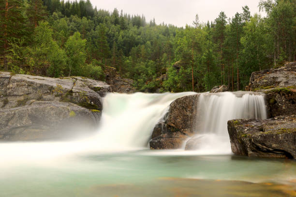Waterfall in river, Tverråfossen, Beiarstua, Beiarn stock photo