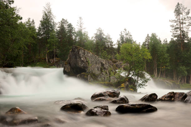 Waterfall in river, Tverråfossen, Beiarstua, Beiarn stock photo