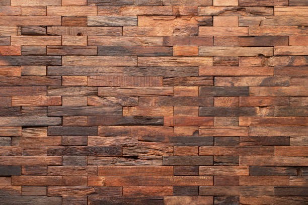 istock surface of wall panel made boards as a background. brown wood texture 1408958272