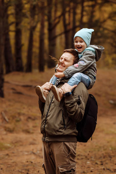 istock Dad and daughter walking in the autumn forest 1408958349