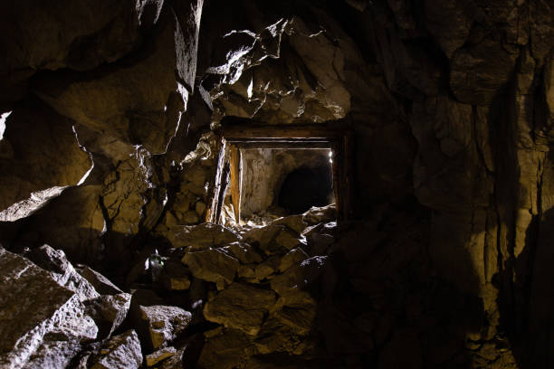 istock Dark and dirty abandoned uranium mine tunnel 1408960146