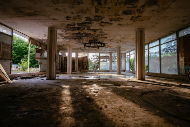 istock Inside of flooded dirty abandoned ruined  building with water reflection 1408964700