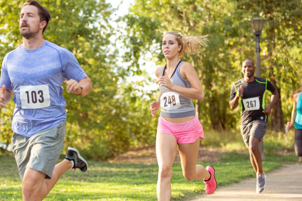 istock Group of adults running in race 1408965639
