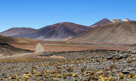 Socaire, Chile, December 2, 2018: View of the road Nr. 23 on the altiplano in Chilean Andes on a sunny day.