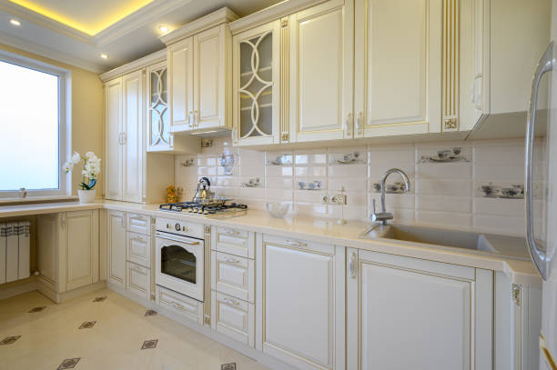 istock Classic white and beige large luxurious kitchen in studio apartment 1408969198