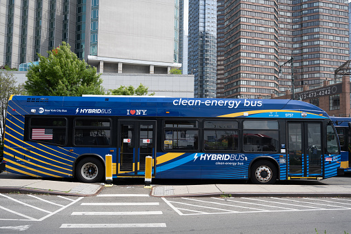 New York, NY, USA - June 3, 2022: A parked clean-energy hybrid bus in Manhattan.