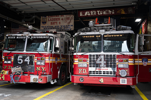 New York, NY, USA - June 11, 2022: FDNY Engine 54 and Ladder 4 in Midtown Manhattan.