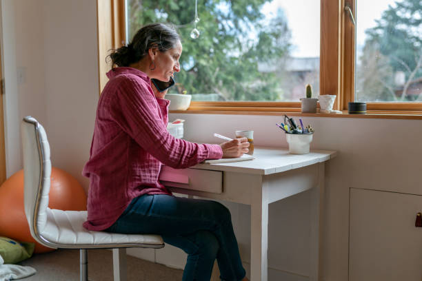 istock Telecommuting woman working in home office 1408973416