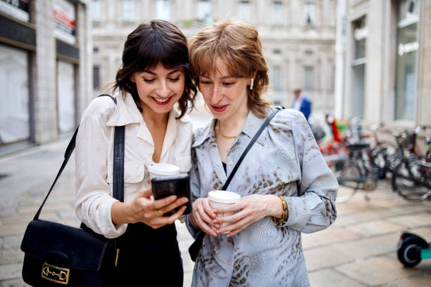 istock Businesswomen looking at the smartphone while commuting 1408974720