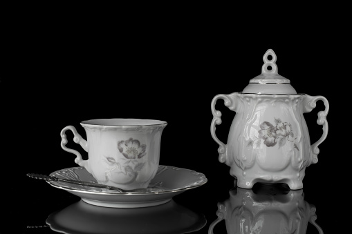 Beautiful porcelain coffe and tea set with handmade floral