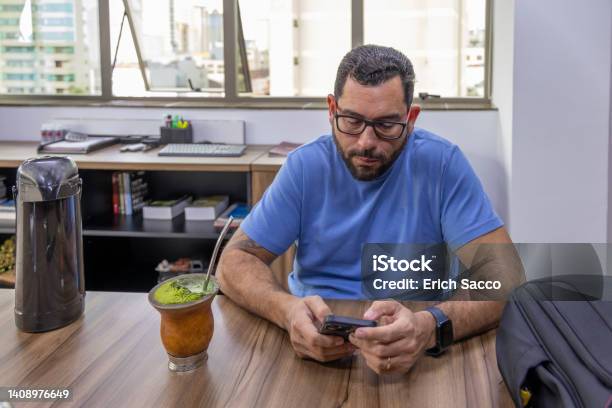 Man Drinking Typical Southern Brazilian Drink In His Office Stock Photo - Download Image Now