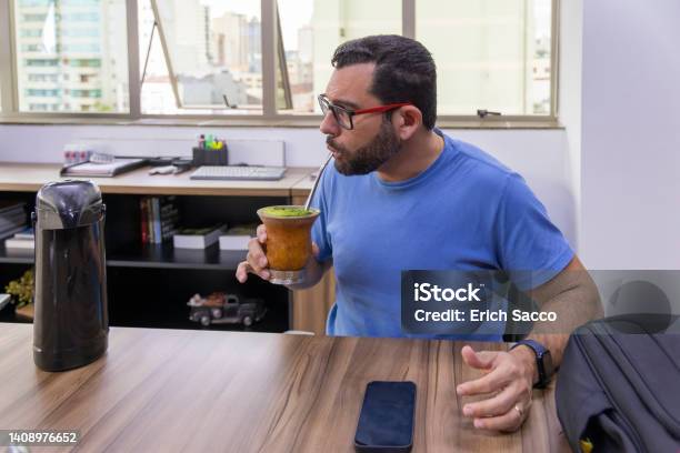 Man Drinking Typical Southern Brazilian Drink In His Office Stock Photo - Download Image Now