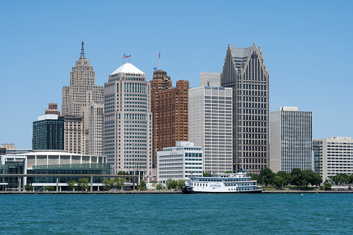 Detroit, Michigan, July 2, 2022: Detroit's skyline viewed from Windsor, Ontario, across the Detroit River.