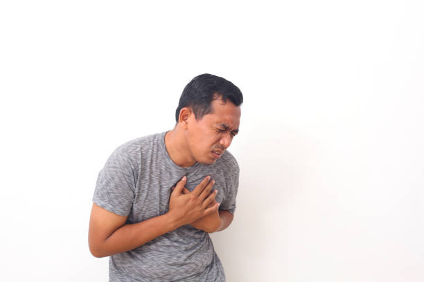 istock Asian man feeling suffering and using hand for touching on chest for checking about his heart attack symptom , mental health care concept 1409000615