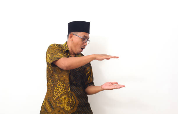 istock Portrait of asian man pointing something on empty space. Isolated on white with copyspace 1409004023