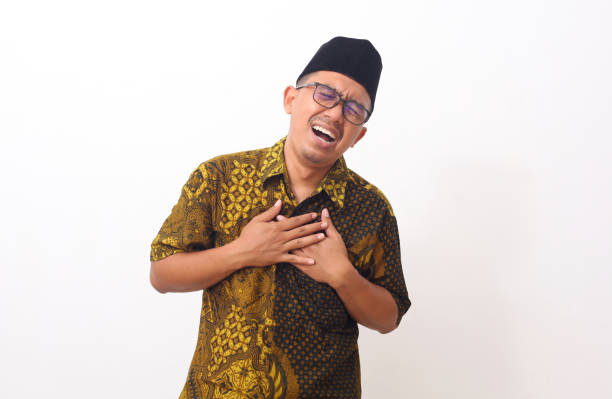 istock Asian man feeling suffering and using hand for touching on chest for checking about his heart attack symptom , mental health care concept 1409007497