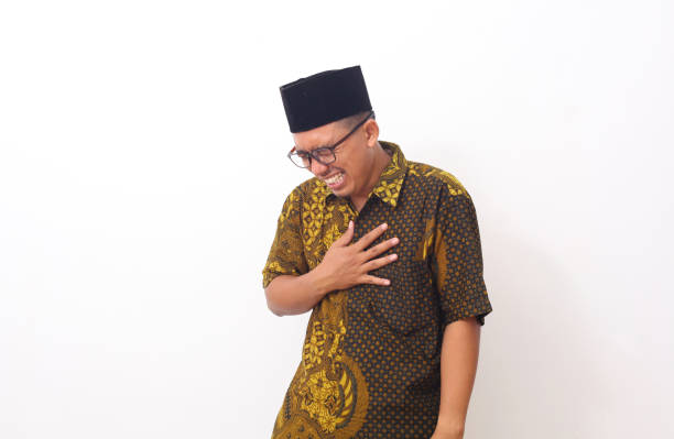 istock Asian man feeling suffering and using hand for touching on chest for checking about his heart attack symptom , mental health care concept 1409007506