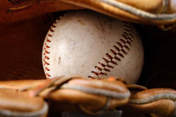 istock Baseball In Old Leather Baseball Glove 1409008050