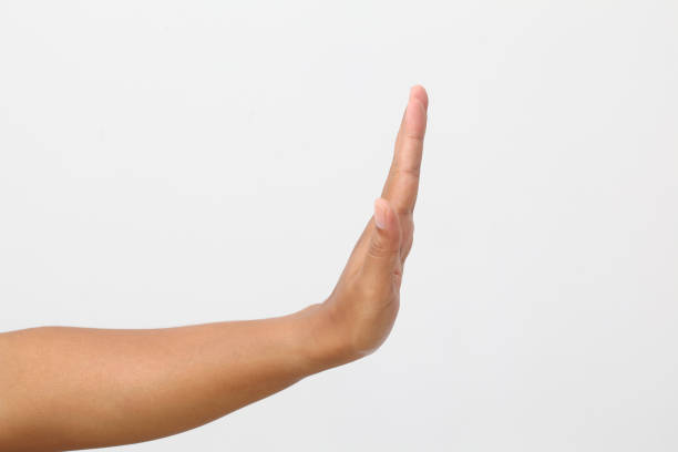 istock Man's hand with stop gesture. Isolated on white background 1409008110