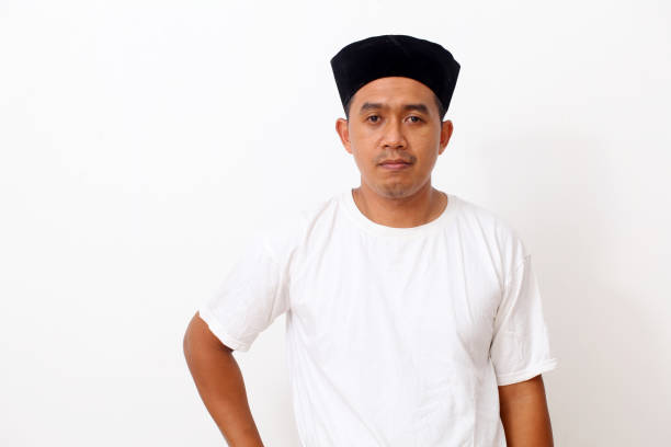 istock Portrait of happy asian man using cap. Isolated on white background. Ramadan concept 1409008946