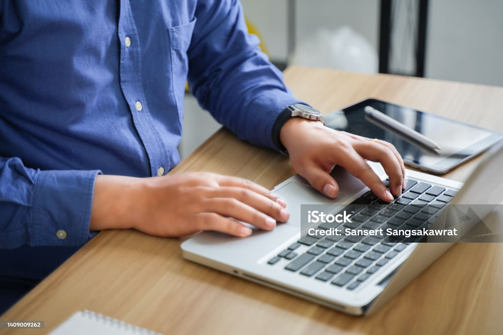 business people who use computers to manage documents online document database and digital file storage systems or software record keeping database technology file access document sharing. Beijing Workers Indoor Arena Stock Photo