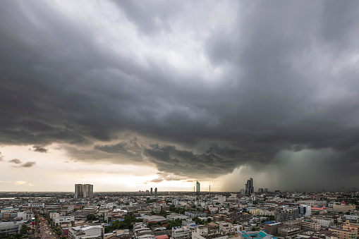 Menacing storm above Bangkok city life background