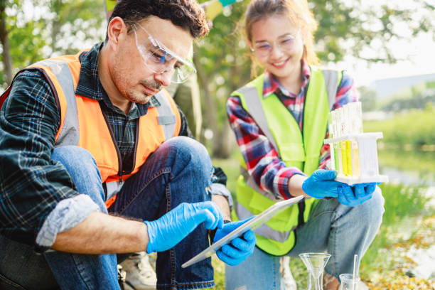 istock Ecologists use a digital tablet while sample water contaminated from industrial estate. 1409017261