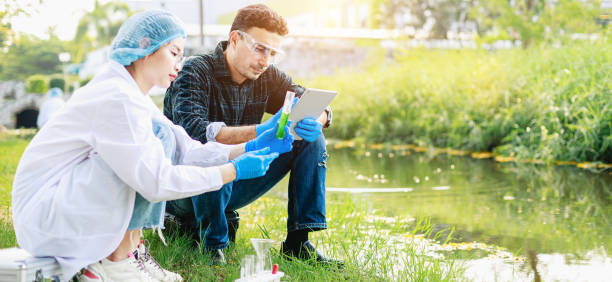 istock Scientists biologists analyze sample water at an industrial estate. Environment issues 1409017297