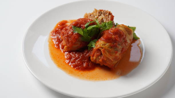 istock Stuffed cabbage rolls with tomato sauce and herbs 1409018920