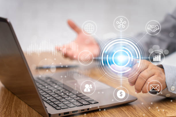 istock Businessman point on virtual screen with business work on digital technology and use laptop working on wood table in office 1409022437