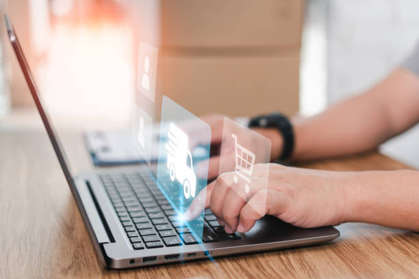 istock Delivery process on virtual screen concept : Close up hand a man tying on laptop check transport delivery parcel box to customer in shopping online on wood table and parcel box in blur background 1409022441
