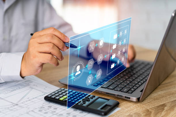 istock Business with engineering work on virtual screen concept, man use laptop work planning and storage document data in cloud technology, work management efficiency of the industry 1409023242