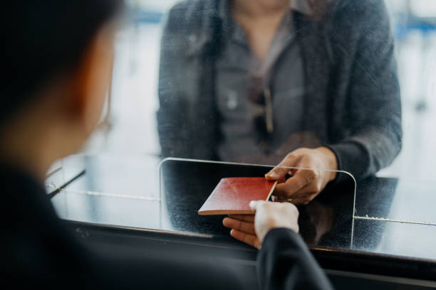istock Passenger checking in at airline counter 1409023505