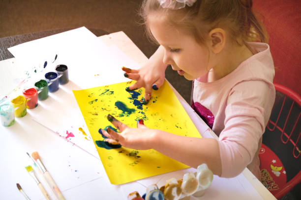 child painting by finger hand . ideas for drawing with finger paints. - child art childs drawing painted image imagens e fotografias de stock