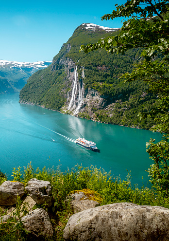 Geiranger, Norway - June 29, 2022: Seven Sisters waterfall in Geirangerfjord, Norway