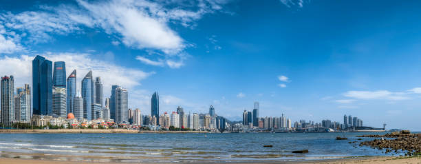 istock Large-format panoramic view of modern buildings along Qingdao coastline 1409033097