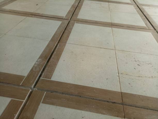 istock dirty brown tile floor in the yard 1409034110