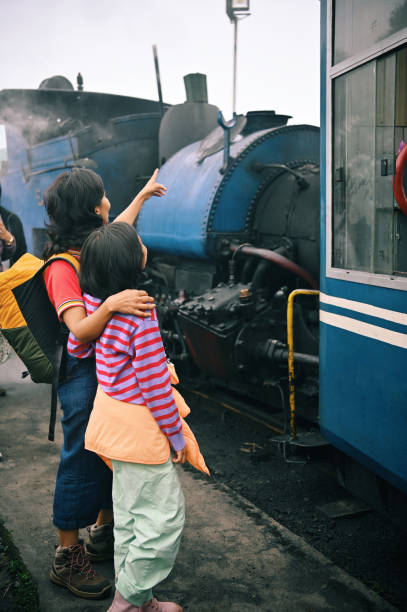 istock Mother showing her daughter steam engine train 1409036364
