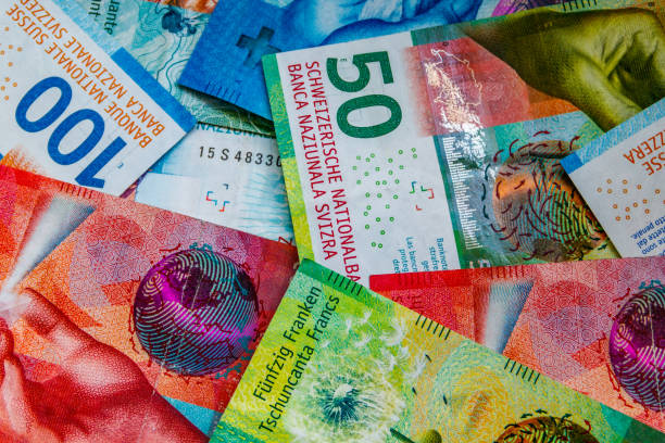 istock Background of the different swiss francs banknotes 1409037753