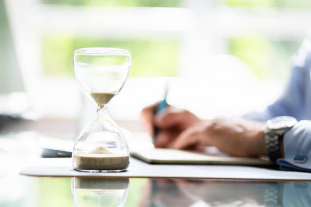 istock Businessperson's Hand Calculating Invoice In Office 1409041091