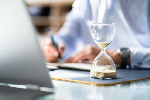 istock Businessperson's Hand Calculating Invoice In Office 1409041103