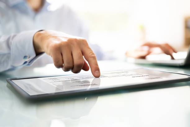 istock Businessperson Analyzing Invoice On Digital Tablet 1409041159