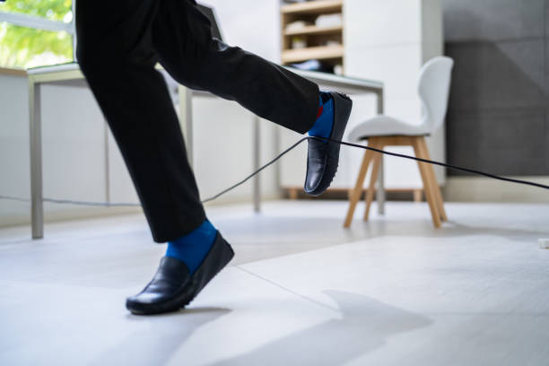istock Wire Cord Trip Over And Fall. Feet Stumble 1409041658